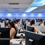 Engaged agents at Tijuana call centers providing exceptional customer service in a modern office.