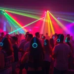 Experience a lively Silent Disco Fort Collins with diverse dancers enjoying vibrant LED lights and headphones.